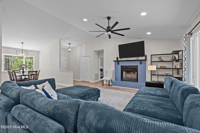 180 Lancashire Ln, West End, NC 27376 - living area with wood finished floors, a fireplace, baseboards, a ceiling fan, and vaulted ceiling