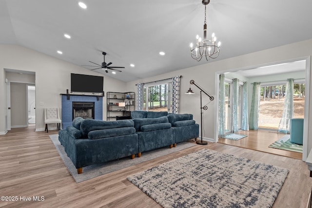 180 Lancashire Ln, West End, NC 27376 - living room with light wood finished floors, vaulted ceiling, recessed lighting, and a brick fireplace