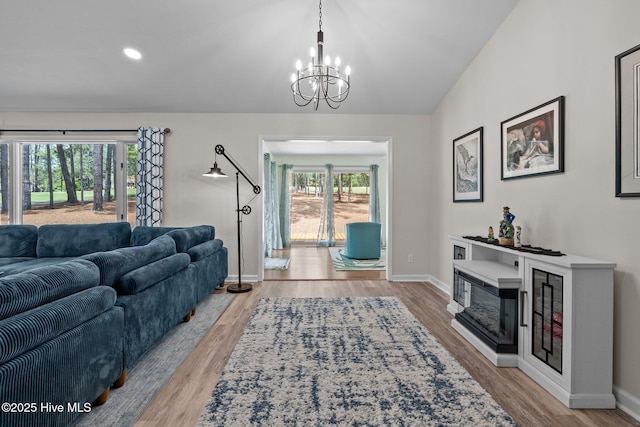 180 Lancashire Ln, West End, NC 27376 - living area featuring baseboards, recessed lighting, wood finished floors, and a chandelier