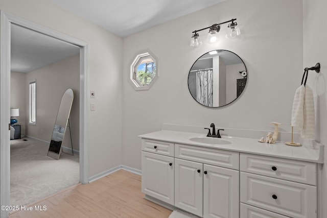 180 Lancashire Ln, West End, NC 27376 - bathroom with baseboards, wood finished floors, and vanity