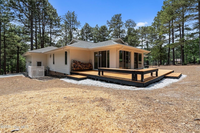 180 Lancashire Ln, West End, NC 27376 - back of house featuring roof with shingles, a wooden deck, a sunroom, and crawl space
