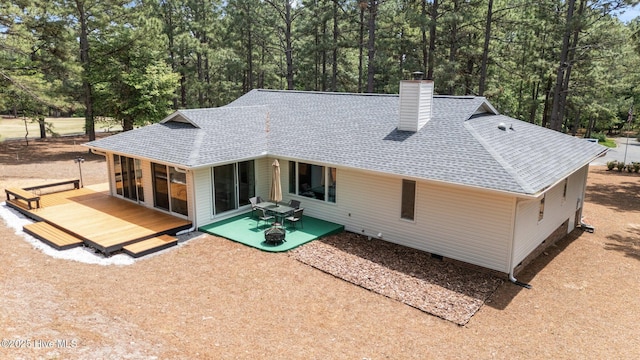 180 Lancashire Ln, West End, NC 27376 - back of property with roof with shingles, a chimney, a deck, and crawl space
