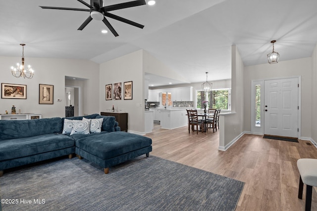 180 Lancashire Ln, West End, NC 27376 - living area with baseboards, ceiling fan with notable chandelier, lofted ceiling, recessed lighting, and light wood-style flooring