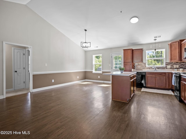 212 Peaceful Ln, Hubert, NC 28539 - kitchen featuring tasteful backsplash, dishwasher, a sink, electric stove, and dark wood-type flooring
