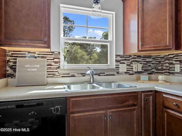 212 Peaceful Ln, Hubert, NC 28539 - kitchen featuring a sink, light countertops, tasteful backsplash, and black dishwasher
