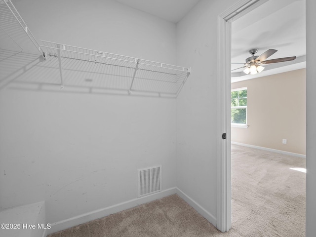 212 Peaceful Ln, Hubert, NC 28539 - spacious closet with a ceiling fan, visible vents, and carpet