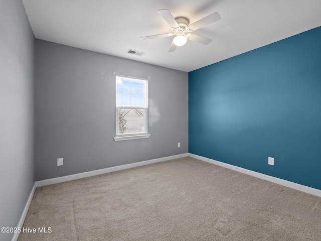 212 Peaceful Ln, Hubert, NC 28539 - spare room with carpet flooring, a ceiling fan, baseboards, and visible vents