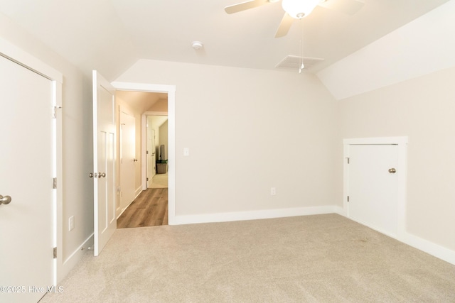 151 Windsor Ln, Edenton, NC 27932 - spare room with baseboards, ceiling fan, vaulted ceiling, and light carpet