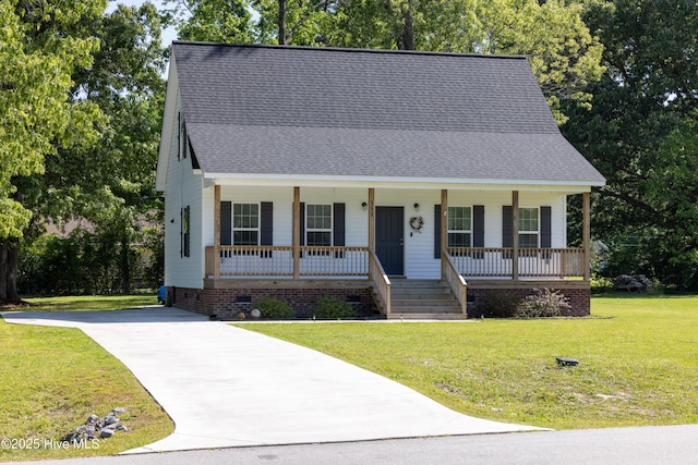151 Windsor Ln, Edenton, NC 27932 - view of front of property with a front lawn, roof with shingles, crawl space, concrete driveway, and a porch