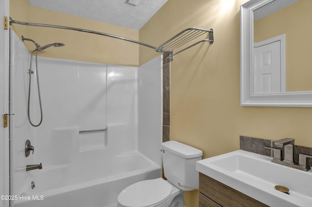 10165 Creekside Dr SE Apt 1, Leland, NC 28451 - bathroom with toilet, a textured ceiling, vanity, and shower / bath combination
