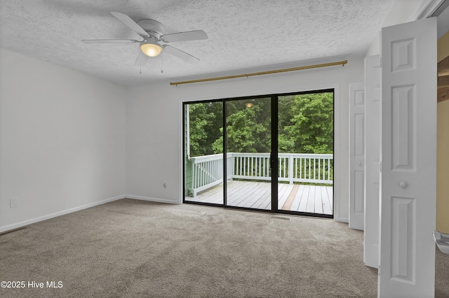 10165 Creekside Dr SE Apt 1, Leland, NC 28451 - carpeted spare room featuring ceiling fan, a textured ceiling, and baseboards