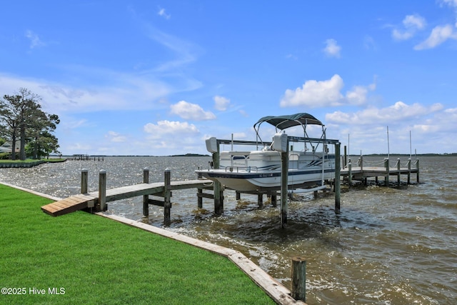 dock area with a water view and boat lift