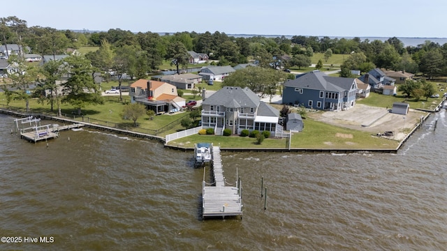 birds eye view of property with a residential view and a water view