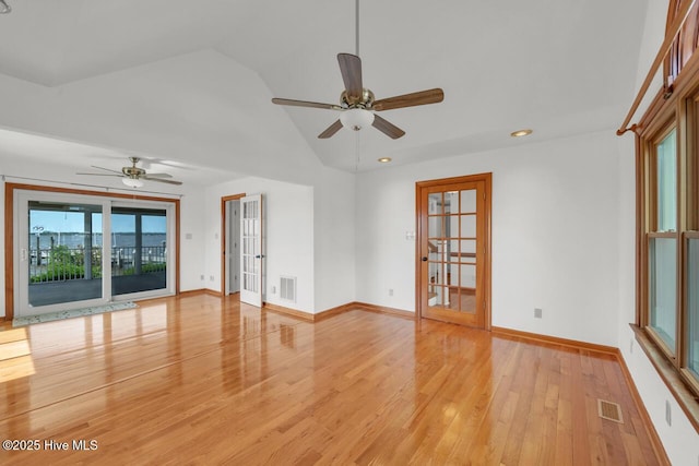 unfurnished room featuring ceiling fan, visible vents, and light wood-style flooring