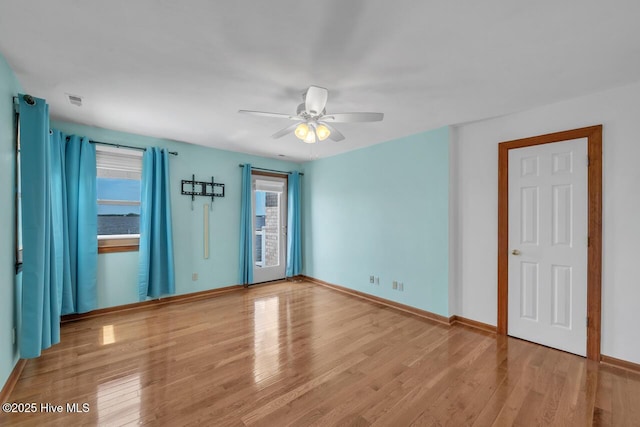 unfurnished bedroom with baseboards and wood finished floors