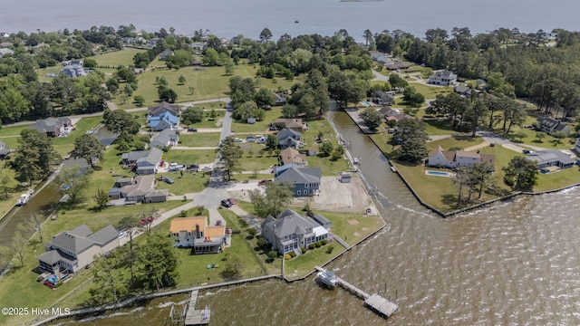 drone / aerial view with a water view and a residential view