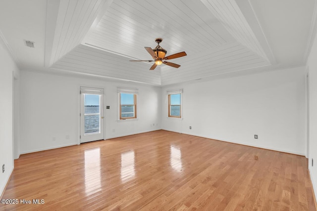 spare room with crown molding, ceiling fan, light wood-style flooring, visible vents, and wood ceiling