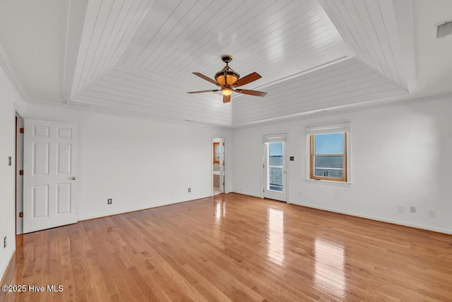 spare room featuring light wood-style floors, wooden ceiling, ceiling fan, and baseboards