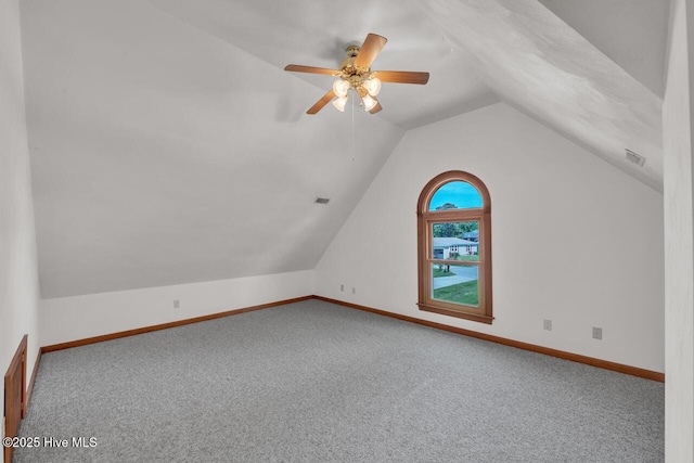 bonus room with baseboards, carpet, and vaulted ceiling