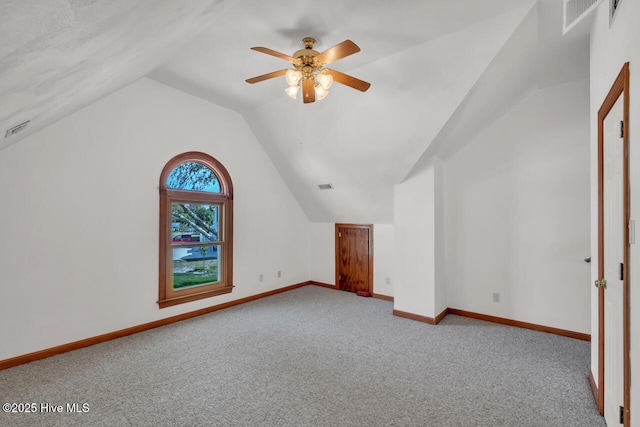 bonus room with visible vents, carpet flooring, baseboards, and vaulted ceiling