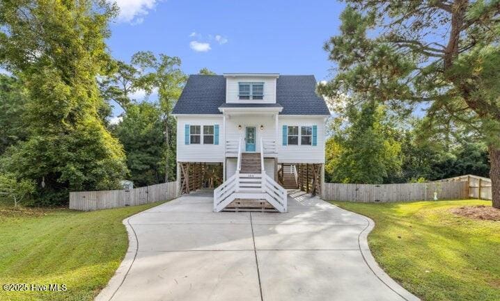 104 Affirmed Pl, Sneads Ferry, NC 28460 - view of front of property with stairway, a carport, and concrete driveway