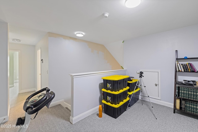 rec room featuring carpet floors and baseboards