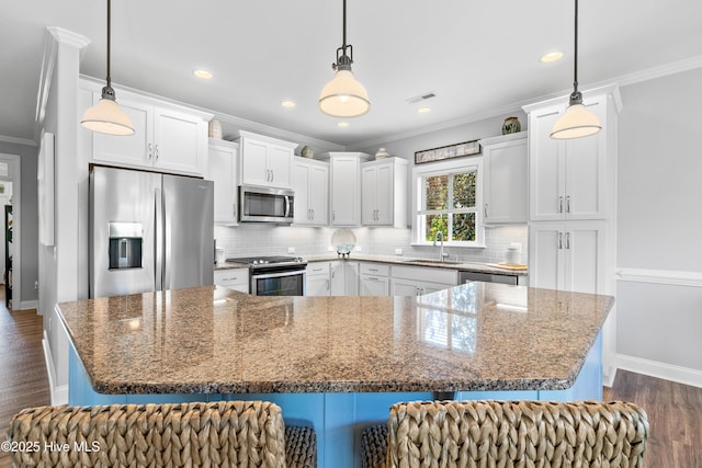 2465 Meridian Rd NE, Leland, NC 28451 - kitchen featuring a sink, decorative backsplash, ornamental molding, and stainless steel appliances