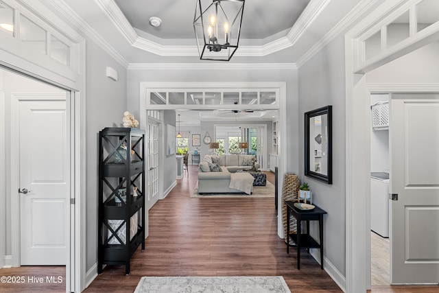 2465 Meridian Rd NE, Leland, NC 28451 - entrance foyer featuring baseboards, washer / dryer, and dark wood-style floors