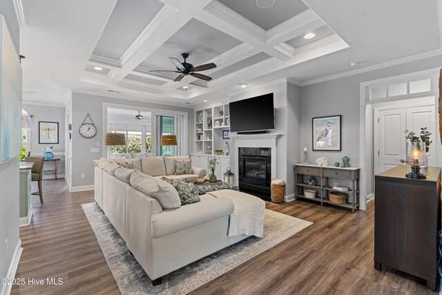 2465 Meridian Rd NE, Leland, NC 28451 - living area featuring dark wood-style flooring, ceiling fan, baseboards, a fireplace with flush hearth, and ornamental molding