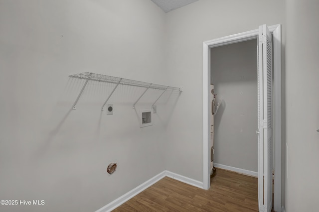 laundry area with hookup for an electric dryer, wood finished floors, baseboards, and hookup for a washing machine