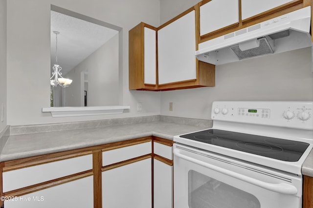 kitchen with white electric range, under cabinet range hood, a chandelier, and white cabinets