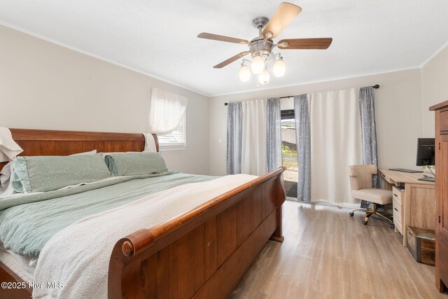 bedroom featuring crown molding, a ceiling fan, access to exterior, and light wood-style flooring