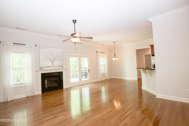 4 Cordelia Way, Vass, NC 28394 - unfurnished living room featuring light wood-type flooring, a ceiling fan, baseboards, and a glass covered fireplace