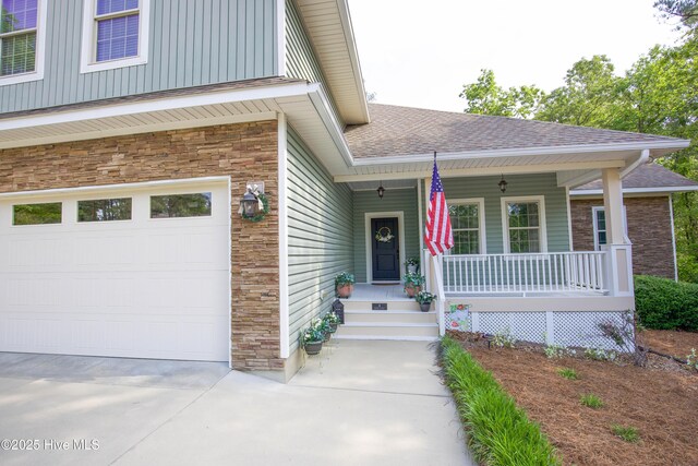 4 Cordelia Way, Vass, NC 28394 - entrance to property with covered porch, stone siding, roof with shingles, board and batten siding, and concrete driveway