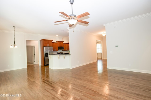 4 Cordelia Way, Vass, NC 28394 - unfurnished living room with a ceiling fan, baseboards, ornamental molding, and light wood-style flooring
