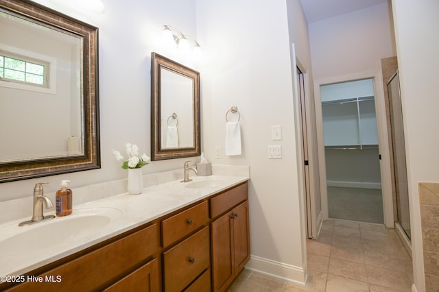 4 Cordelia Way, Vass, NC 28394 - bathroom featuring double vanity, baseboards, a sink, and tile patterned flooring
