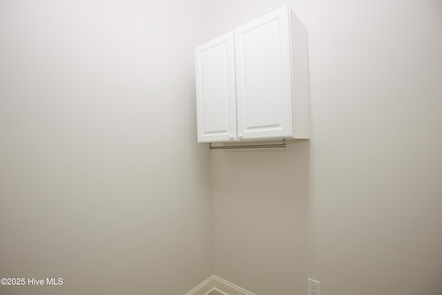 4 Cordelia Way, Vass, NC 28394 - laundry area featuring baseboards and cabinet space