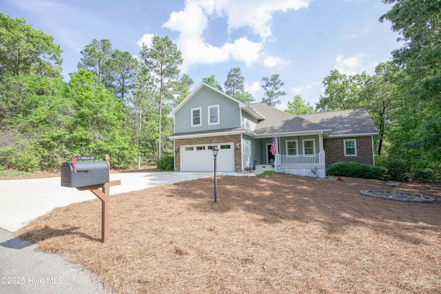 4 Cordelia Way, Vass, NC 28394 - traditional-style house featuring covered porch, an attached garage, concrete driveway, and a shingled roof
