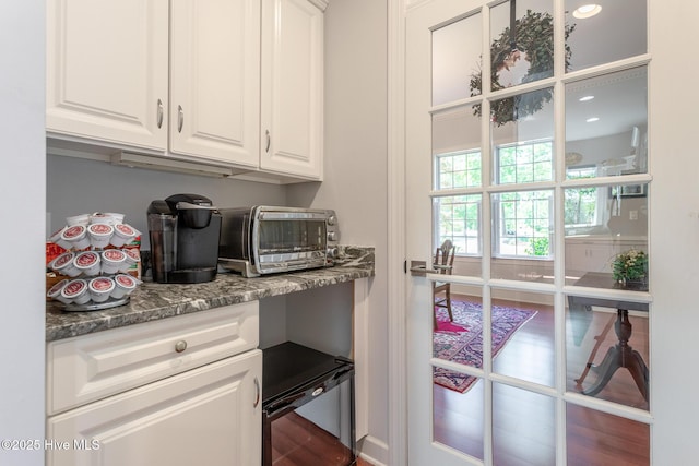interior space featuring wood finished floors, recessed lighting, and a toaster
