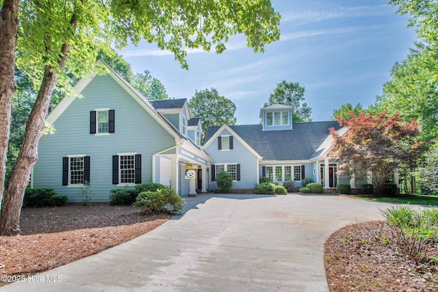 view of front of property featuring a garage and concrete driveway