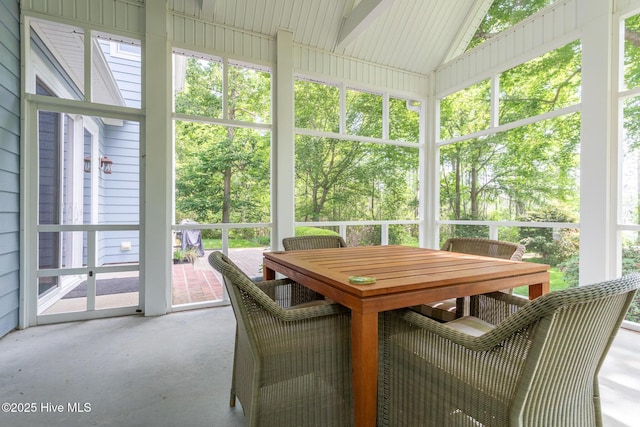 sunroom with outdoor dining area
