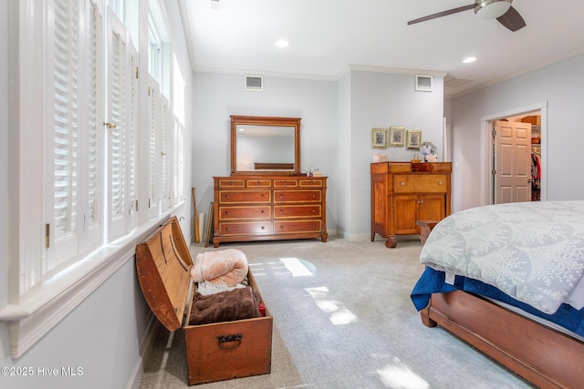 carpeted bedroom with recessed lighting, baseboards, visible vents, and ornamental molding