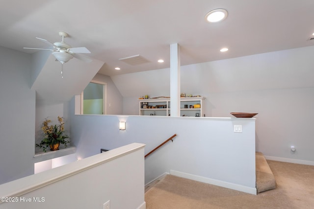interior space with visible vents, lofted ceiling, ceiling fan, recessed lighting, and carpet