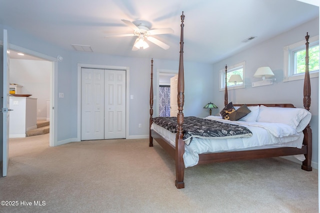 bedroom featuring baseboards, visible vents, ceiling fan, and carpet