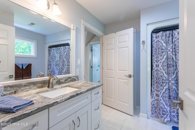 bathroom with tile patterned floors, a shower with shower curtain, vanity, and visible vents