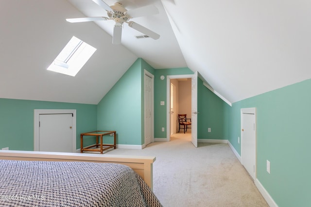 bedroom with carpet floors, a ceiling fan, baseboards, lofted ceiling, and visible vents