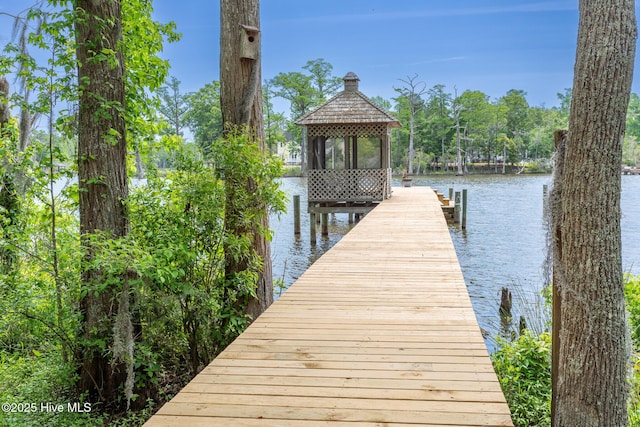 dock area featuring a gazebo and a water view