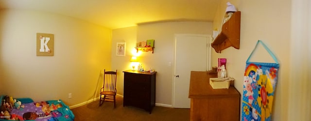 rec room with baseboards and carpet