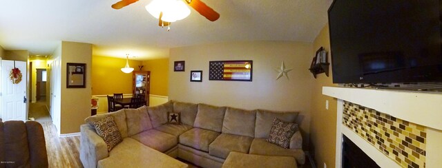 living area featuring ceiling fan