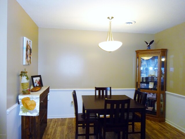 dining area with wood finished floors
